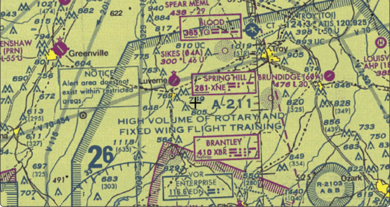 Sectional chart excerpt showing alert area A-211, labeled "HIGH VOLUME OF ROTARY AND FIXED WING FLIGHT TRAINING", with a note that the alert area is depicted to advise pilots of the activity.